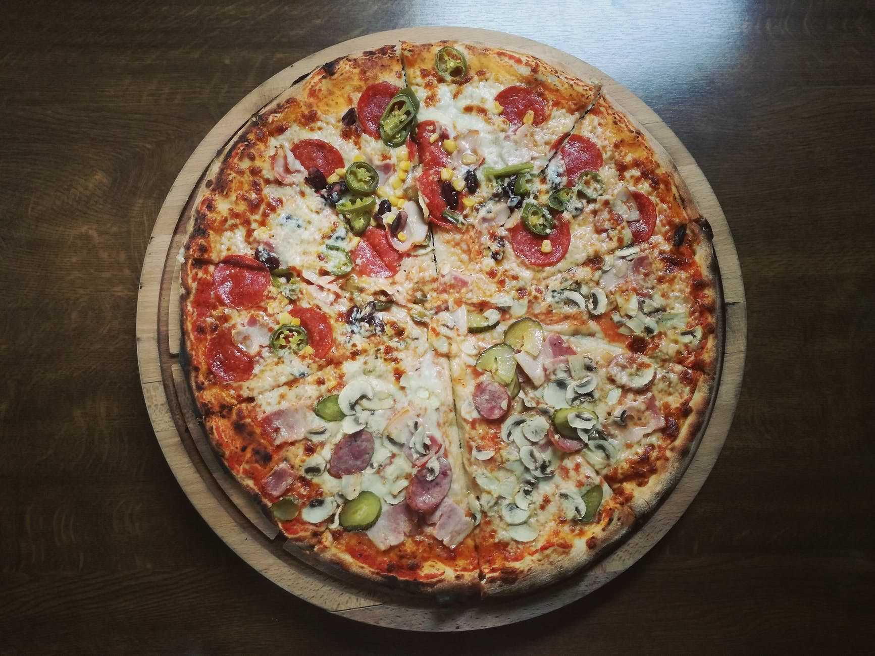 Overhead view of pepperoni mushroom pizza